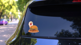 Burger Character Dreaming Of French Fries Sticker on a Rear Car Window (New) example