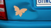 Butterfly Band Aid Bandage Sticker on a Dented Car example
