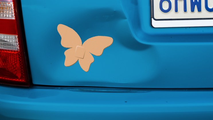 Butterfly Band Aid Bandage Sticker on a Dented Car example