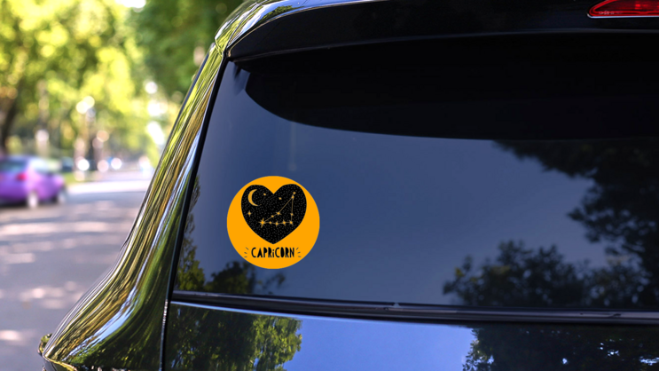 Capricorn Symbol In Black Heart Sticker  on a Rear Car Window (New) example
