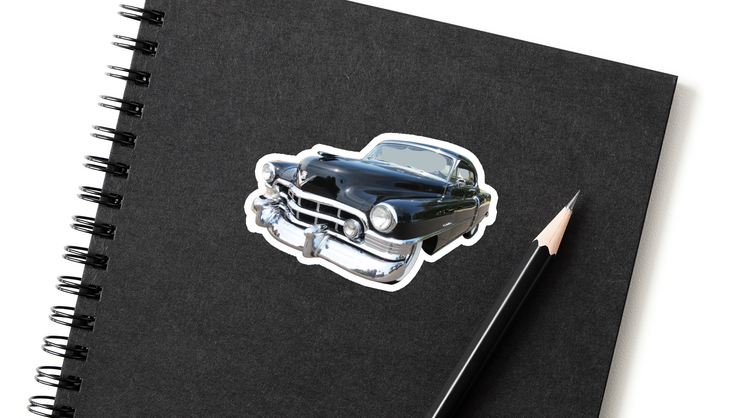 A sticker of a car applied to a notebook