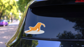 Cartoon Cheetah Stretching Back Sticker on a Rear Car Window (New) example