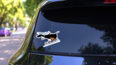 Cartoon Dog Rids On Sled Illustration Sticker on a Rear Car Window (New) example