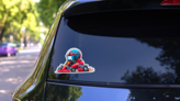 Cartoon Go Kart Racer Sticker on a Rear Car Window (New) example