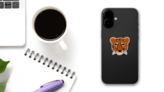 Cartoon Hand Drawn Cheetah Head Sticker on a Phone (New) example