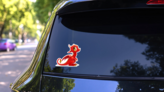 Cartoon Little Red Dragon Sticker on a Rear Car Window (New) example