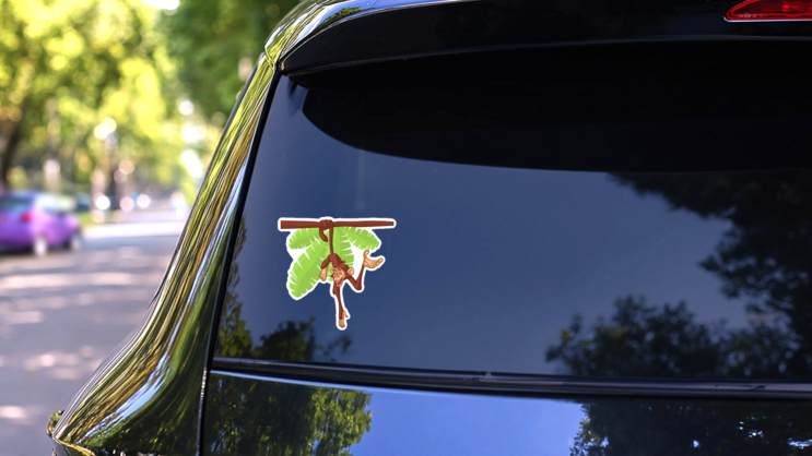 Cartoon Monkey Hanging From The Tree Sticker on a Rear Car Window (New) example