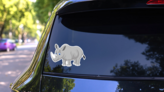 Cartoon Rhino Sticker on a Rear Car Window (New) example