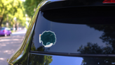 Cartoon Rocket Sticker on a Rear Car Window (New) example