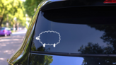 Cartoon Sheep Lamb With Large Eyes Sticker on a Rear Car Window (New) example