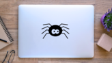 Cartoon Spider with Giant Eyes Sticker on a Laptop (New) example