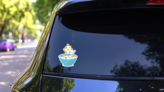 Cereal Bowl With Splash Of Milk Sticker on a Rear Car Window (New) example