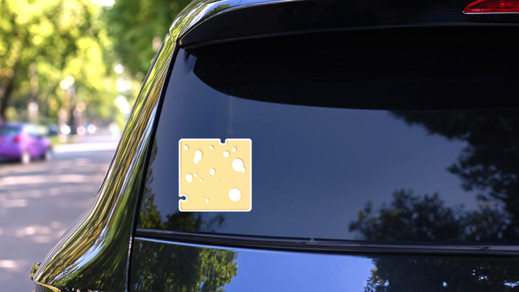Cheese Slice With Holes In Shape Of A Square Sticker on a Rear Car Window (New) example