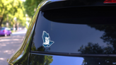 Christian Boy And Girl In Prayer Sticker on a Rear Car Window (New) example