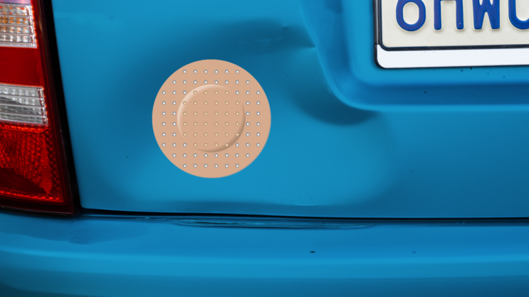 Circle Band Aid Bandage Sticker on a Dented Car example
