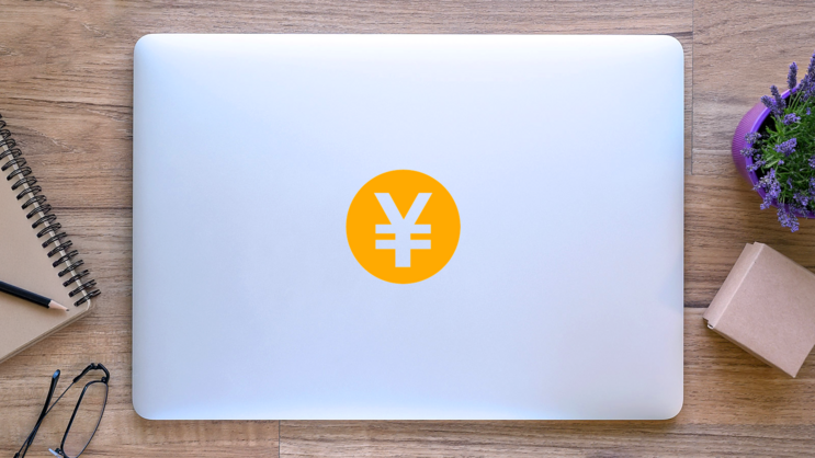 Circle Japanese Yen Sticker on a Laptop (New) example