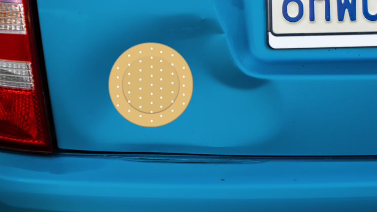 Circular Band Aid Bandage Sticker on a Dented Car example
