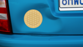 Circular Band Aid Bandage Sticker on a Dented Car example