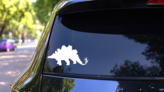 Classic Stegosaurus Dinosaur Sticker on a Rear Car Window (New) example
