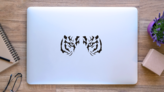 Close Up Tiger Eyes Sticker on a Laptop (New) example