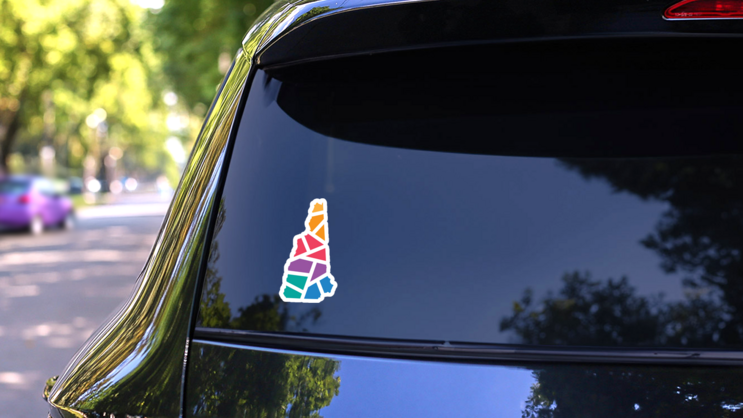 Colorful Geometric New Hampshire Map Sticker on a Rear Car Window (New) example