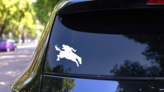Cowboy Flying Off A Horse Sticker on a Rear Car Window (New) example
