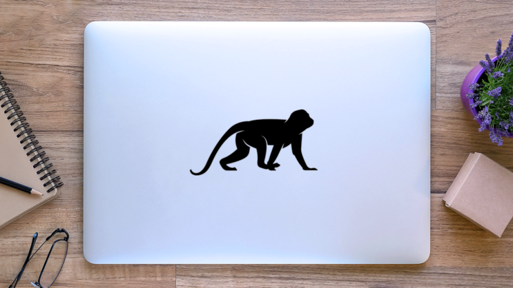 Crawling Monkey Silhouette Sticker on a Laptop (New) example