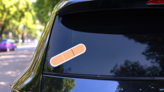 Creative Vector Illustration Of Adhesive Bandage Medical Sticker on a Rear Car Window (New) example