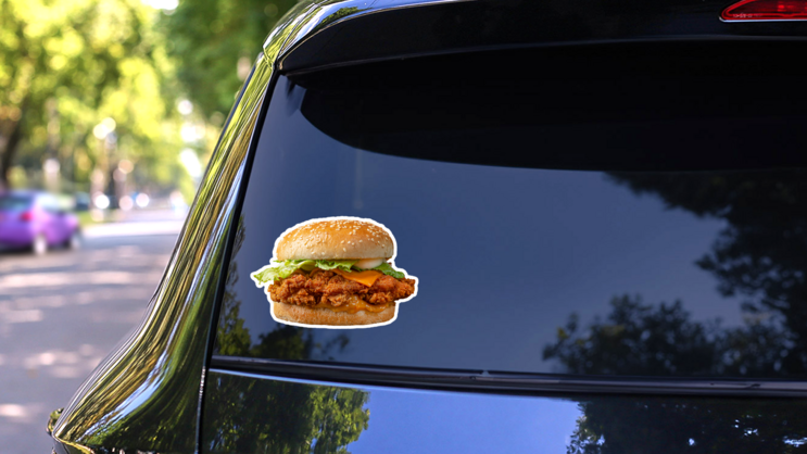 Crispy Cheesy Chicken Patty Burger Sticker on a Rear Car Window (New) example