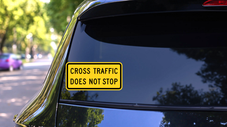 Cross Traffic Does Not Stop Sticker on a Rear Car Window (New) example