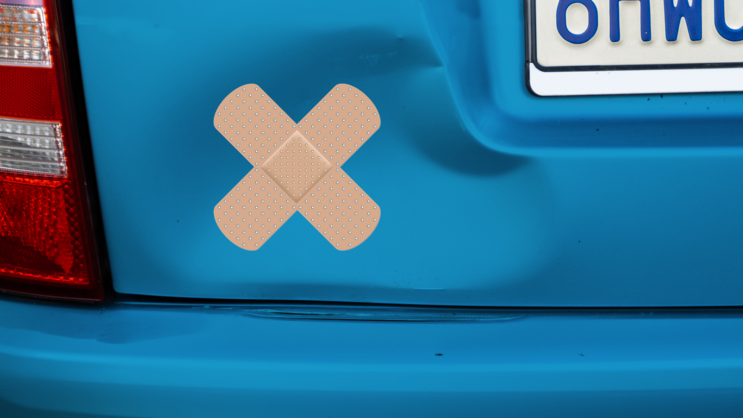 Crossed Beige Band Aid Sticker on a Dented Car example