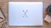 Crossed Ski Poles Sticker on a Laptop (New) example