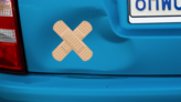 Crossed Standard Bandage Sticker on a Dented Car example