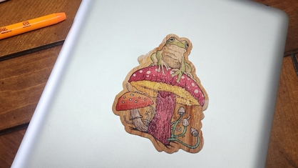 Custom frog artwork on a wood sticker