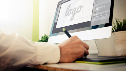 Designer creating a custom logo on the computer