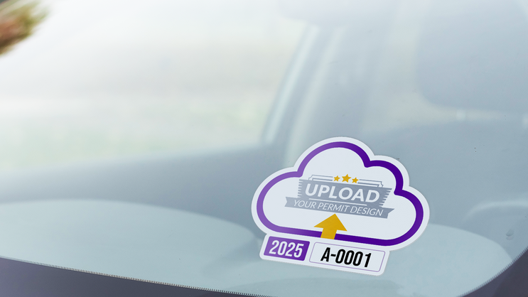 A custom parking permit with an uploaded design on the inside of a windshield.