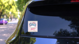 Cute Cat With Glasses Meow Sticker on a Rear Car Window (New) example