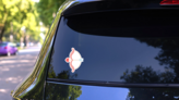 Cute Cupid Bow And Arrow Cartoon Sticker on a Rear Car Window (New) example