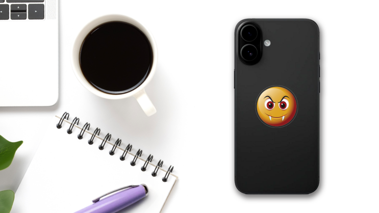 Cute Fangs Emoji Sticker on a Phone (New) example