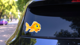 Cute Fish Cartoon Sticker on a Rear Car Window (New) example