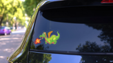 Cute Green Fire Breathing Dragon Sticker on a Rear Car Window (New) example