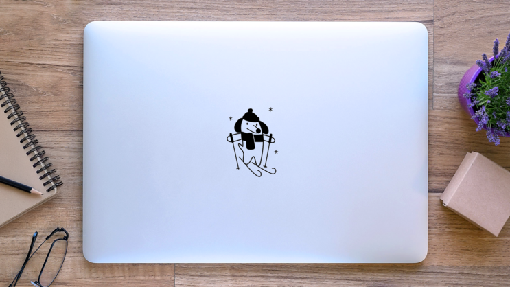 Cute Little Dog Skiing Sticker on a Laptop (New) example
