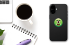 Cute One Eyed Green Monster Emoji Sticker on a Phone (New) example