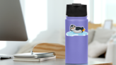 Cute Penguin Cartoon On Ice Float Sticker on a Water Bottle (New) example