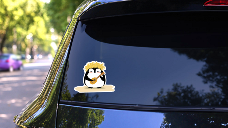 Cute Penguin In Hawaiian Yellow Grass Wreath And Ukulele Sticker on a Rear Car Window (New) example