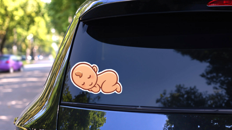 Cute Sleeping Baby Illustration Sticker on a Rear Car Window (New) example