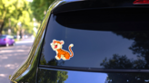 Cute Tiger Cartoon Roaring Sticker on a Rear Car Window (New) example