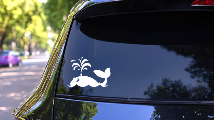 Cute Whale Blowing Out Water Sticker on a Rear Car Window (New) example
