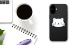 Cute White Kitten Face Sticker on a Phone (New) example