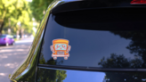 Cute Yellow School Bus Character With Eyes on a Rear Car Window (New) example
